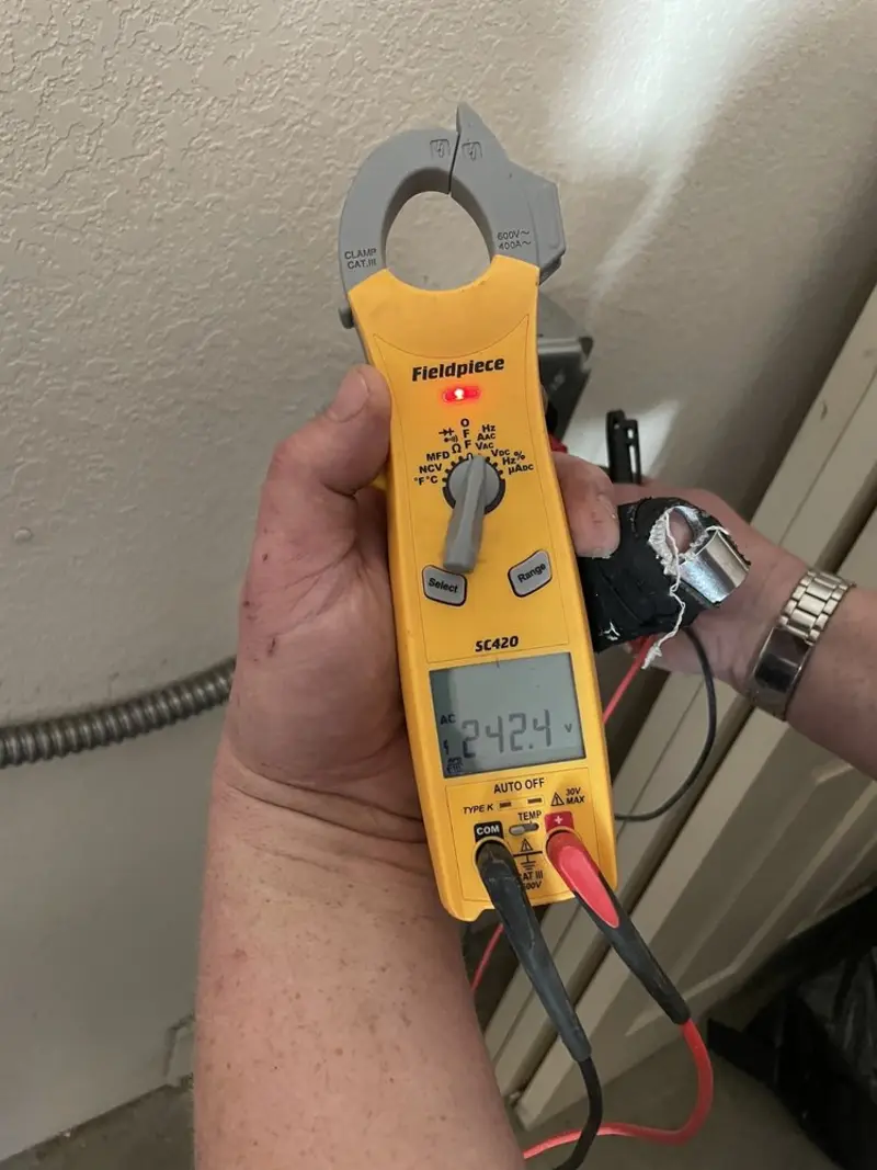 Voltage testing with clamp meter during Electrical Installation Services in Bullhead City